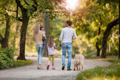 GettyImages 990857722 family walking path small